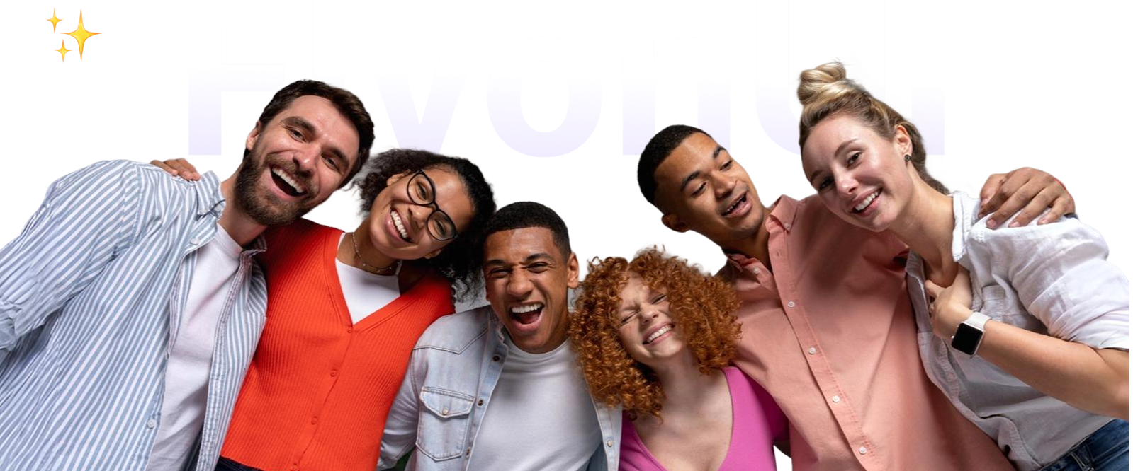 A group of smiling team members posing together in a modern office setting.
